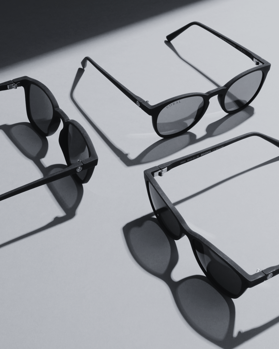 A black and white image of glasses frames