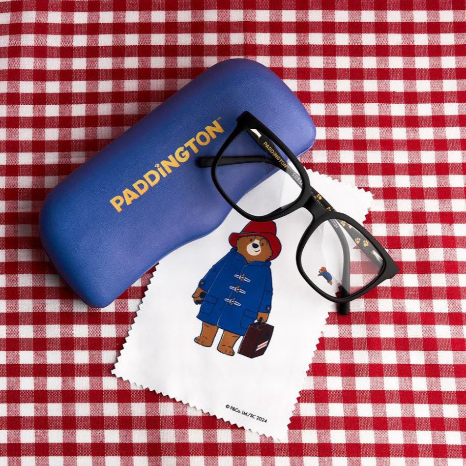 Blue glasses case with 'Paddington' text and a pair of glasses on a red and white checkered background.